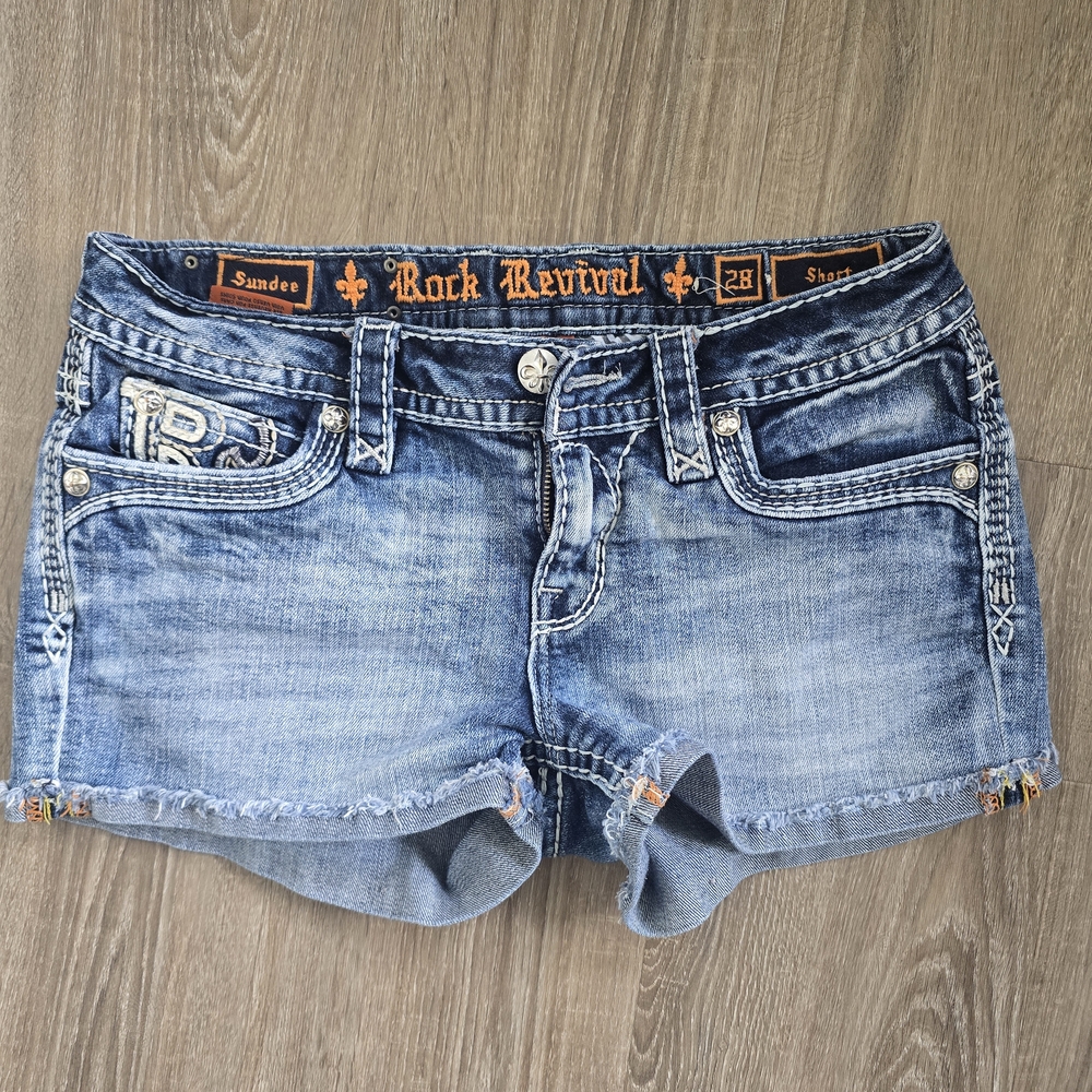 Rock Revival Sundee Blue Jean Shorts with Distressed Hem. Size 28